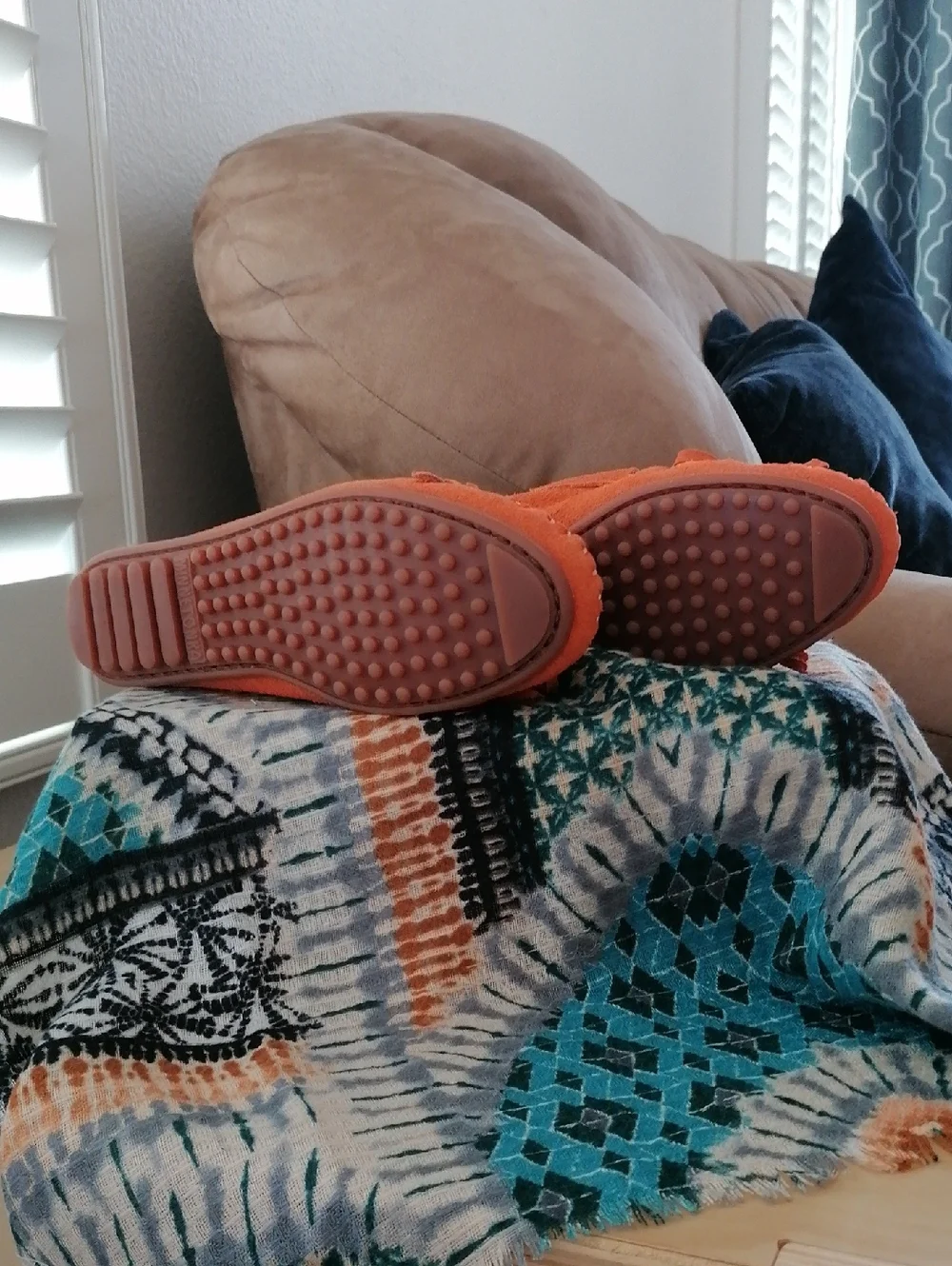 Minnetonka  Orange soft suede hard sole Moccasin.Never worn. Runs  big 5.5 = 6.5